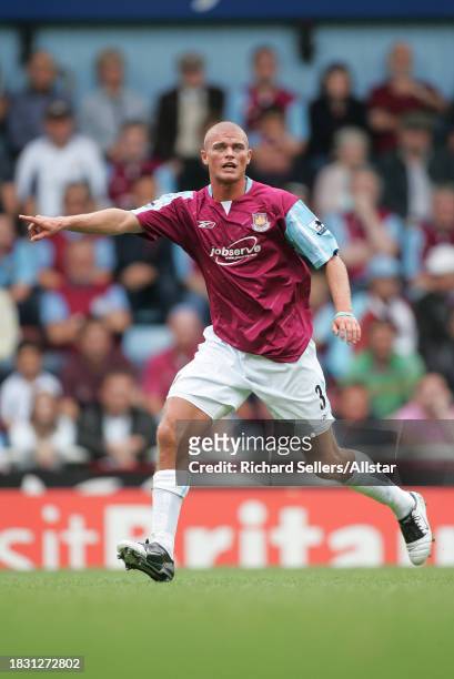 September 24: Paul Konchesky of West Ham United shouting during the Premier League match between West Ham United and Arsenal at Upton Park on...