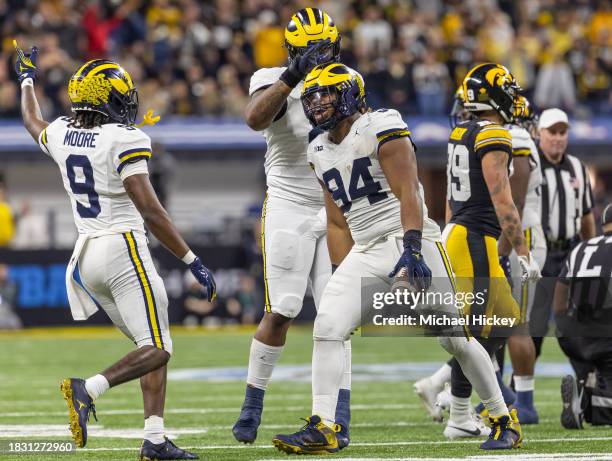 Kris Jenkins of the Michigan Wolverines celebrates a turnover during the Big Ten Championship against the Iowa Hawkeyes at Lucas Oil Stadium on...