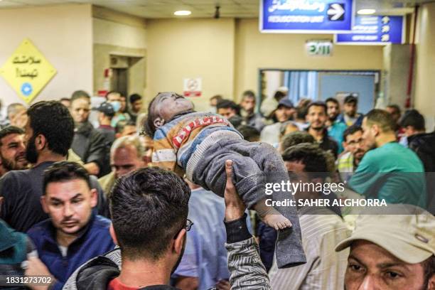 Khan Yunis, Palestine. In the aftermath of an Israeli airstrike on December 7 a heart-wrenching scene unfolded at Nasser Medical Hospital in Khan...