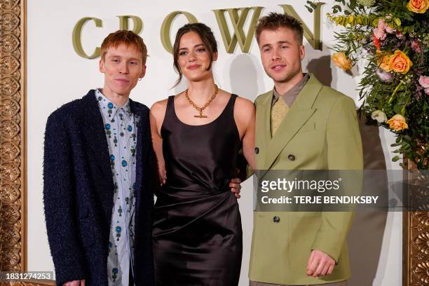 British actors Luther Ford, Meg Bellamy and Ed McVey pose on the red carpet before the premiere of the last episode of 'The Crown' at the Opera House...