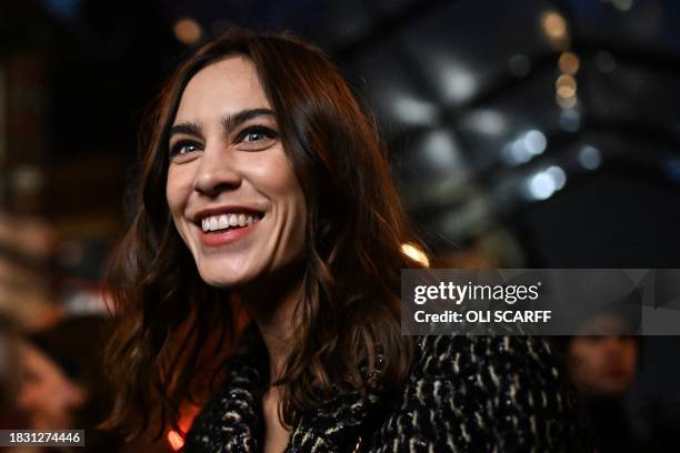 British model Alexa Chung arrives to attend the "Chanel Metiers d'art 2023-2024" fashion show, in Thomas Street, in Manchester, northern England, on...