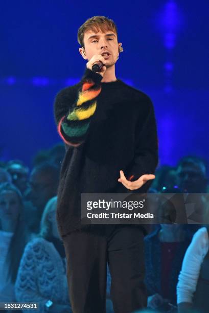 In this photo released on December 7 Mike Singer is seen on stage during the "Kiwis grosse Partynacht" TV show recording at Studio Berlin Adlershof...