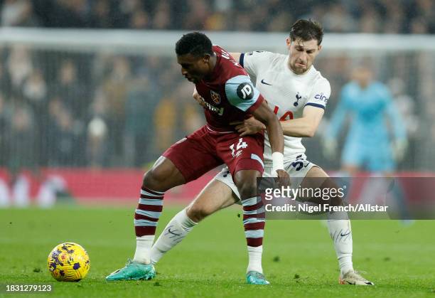 Mohammed Kudus of West Ham United and Ben Davies of Tottenham Hotspur challenge during the Premier League match between Tottenham Hotspur and West...