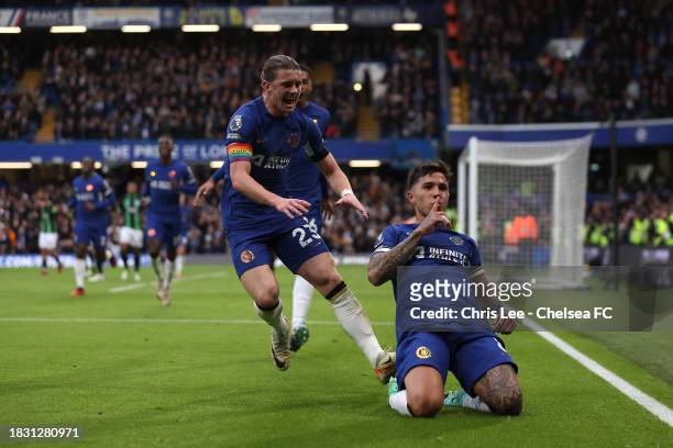 Enzo Fernandez of Chelsea celebrates scoring their first goal with Conor Gallagher and Levi Colwill during the Premier League match between Chelsea...