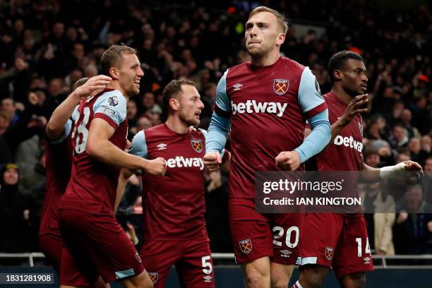 West Ham United's English striker Jarrod Bowen celebrates after scoring the equalising goalduring the English Premier League football match between...