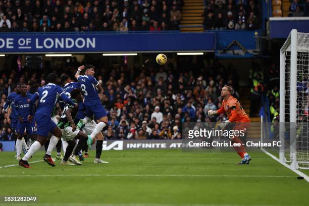 Enzo Fernandez of Chelsea scores their first goal during the Premier League match between Chelsea FC and Brighton & Hove Albion at Stamford Bridge on...