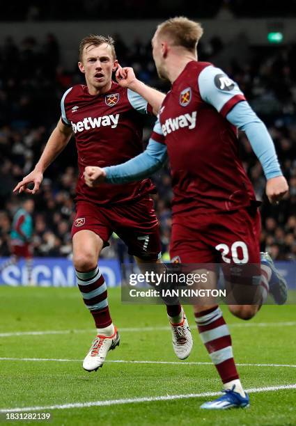 West Ham United's English midfielder James Ward-Prowse celebrates scoring the team's second goal with West Ham United's English striker Jarrod Bowen...