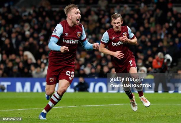 West Ham United's English midfielder James Ward-Prowse celebrates scoring the team's second goal with West Ham United's English striker Jarrod Bowen...