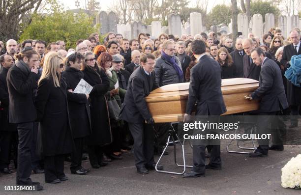 French filmmaker and producer Claude Berri's son Darius, his last companion Nathalie Rheims, his son Thomas Langmann attend Berri's funeral on...