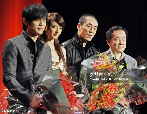 Film director Zhang Yimou , an internationally acclaimed Chinese filmmaker, poses with producer Bill Kong , actor Jay Chou , and Leah Dizon , a...