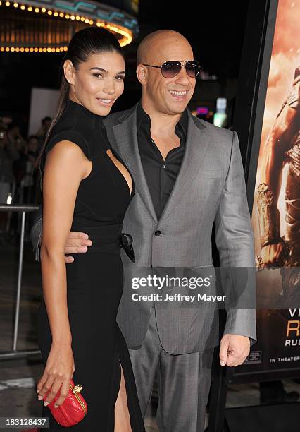 Actors Vin Diesel and Paloma Jimenez arrive at the Los Angeles premiere of 'Riddick' at the Westwood Village Theatre on August 28, 2013 in Westwood,...