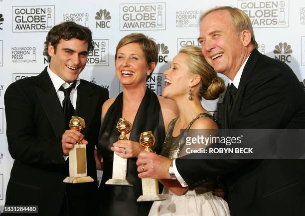 Actors Reese Witherspoon and Joaquin Phoenix pose with producers Cathy Konrad and James Keach with the trophies they won for "Walk The Line" at the...