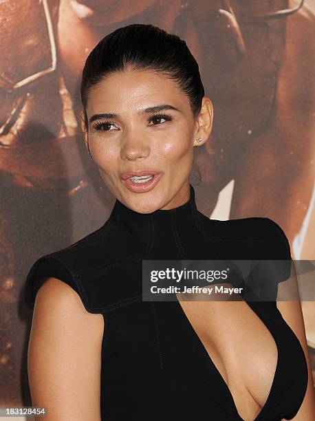 Actress Paloma Jimenez arrives at the Los Angeles premiere of 'Riddick' at the Westwood Village Theatre on August 28, 2013 in Westwood, California.