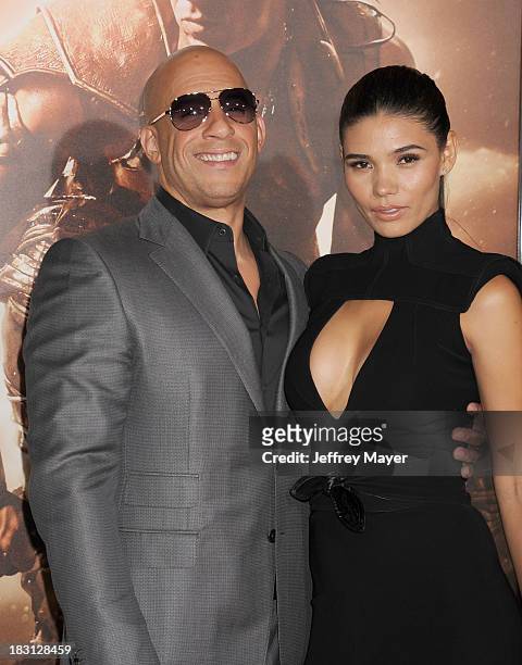 Actors Vin Diesel and Paloma Jimenez arrive at the Los Angeles premiere of 'Riddick' at the Westwood Village Theatre on August 28, 2013 in Westwood,...