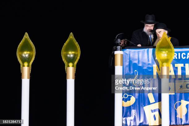 Rabbi Levi Shemtov, executive vice president of American Friends of Lubavitch, and Chabad-Lubavitch rabbi Abraham Shemtov light the menorah during...
