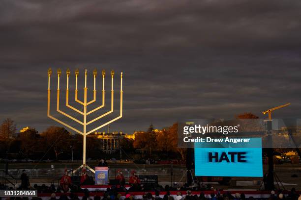Video message about antisemitism plays during the annual National Menorah Lighting ceremony, on the Ellipse south of the White House December 7, 2023...
