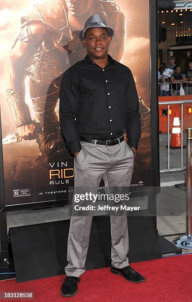 Actor Bokeem Woodbine arrives at the Los Angeles premiere of 'Riddick' at the Westwood Village Theatre on August 28, 2013 in Westwood, California.