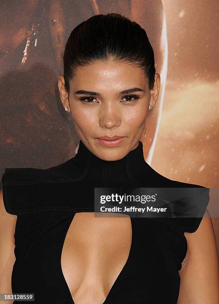 Actress Paloma Jimenez arrives at the Los Angeles premiere of 'Riddick' at the Westwood Village Theatre on August 28, 2013 in Westwood, California.