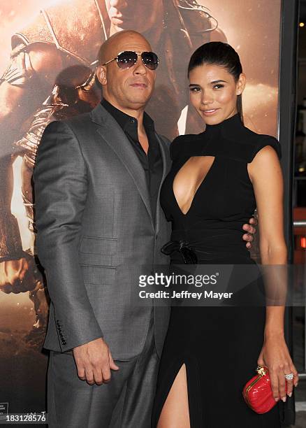 Actors Vin Diesel and Paloma Jimenez arrive at the Los Angeles premiere of 'Riddick' at the Westwood Village Theatre on August 28, 2013 in Westwood,...