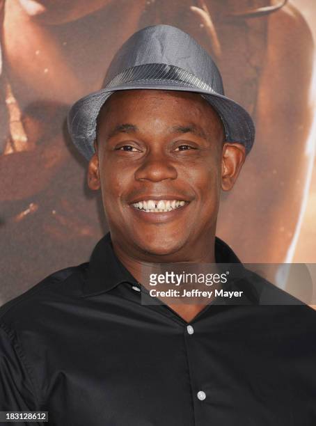 Actor Bokeem Woodbine arrives at the Los Angeles premiere of 'Riddick' at the Westwood Village Theatre on August 28, 2013 in Westwood, California.