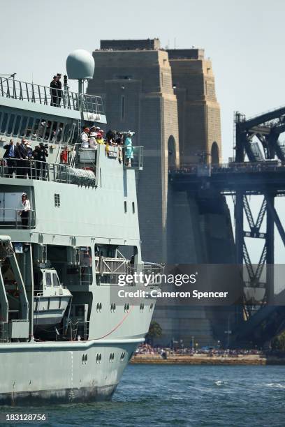 Prince Harry and Australian Governor-General Quentin Bryce onboard the HMAS Leeuwin observe ships during the 2013 International Fleet Review on...