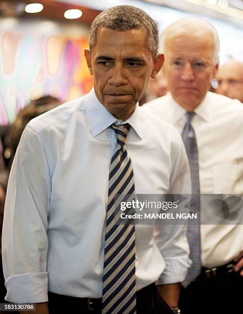 President Barack Obama and US Vice President Joe Biden arrive to order lunch to go at Taylor Gourmet Deli on Pennsylvania Ave in Washington, DC on...