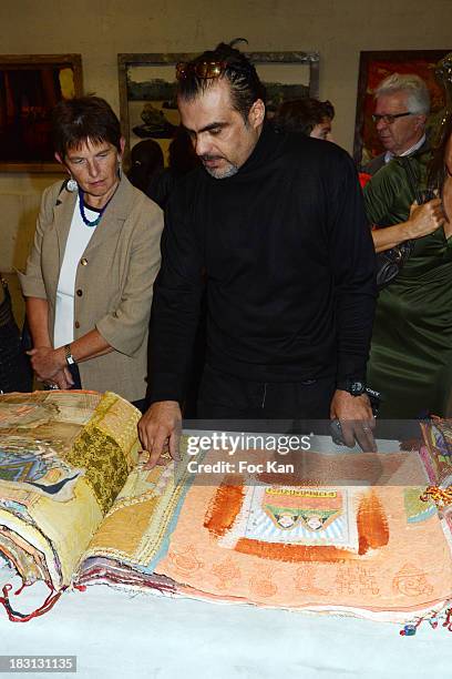 Photographer Chayan Khoi attends 'La Mondiale Des Puces 2014' Launch Cocktail at Marche Aux Puces De Clignancourt on October 4, 2013 in Paris, France.