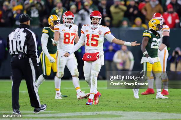 Patrick Mahomes of the Kansas City Chiefs looks to back judge Greg Yette during a game against the Green Bay Packers at Lambeau Field on December 03,...