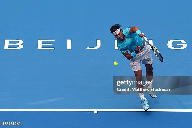 Rafael Nadal of Spain serves to Tomas Berdych of Czech Republic during the semifinals of the 2013 China Open at the National Tennis Center on October...