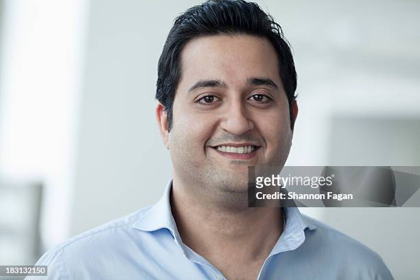 portrait of young smiling businessman - 25 years stock pictures, royalty-free photos & images