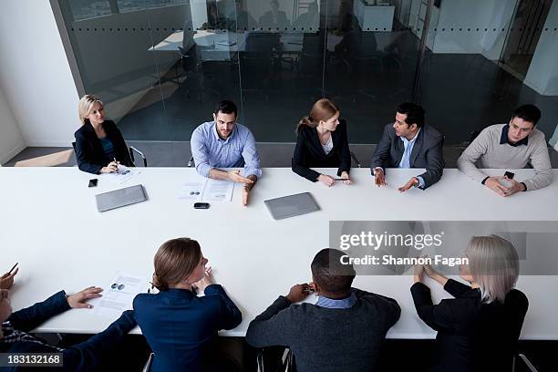 group of business people having a business meeting - people sitting in a row stock pictures, royalty-free photos & images