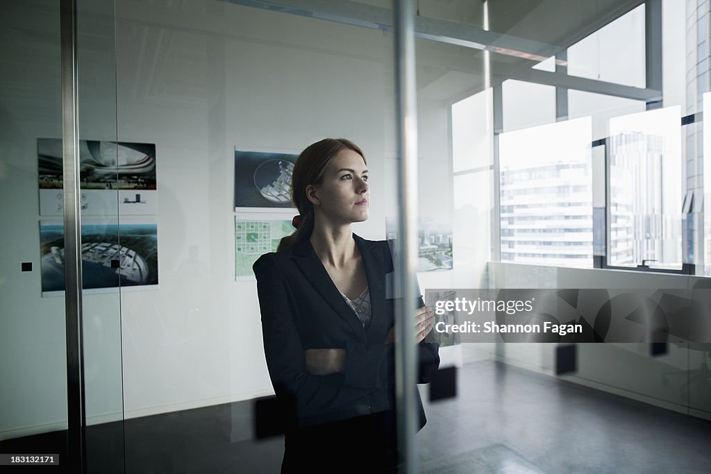 Businesswoman deep in thoughts