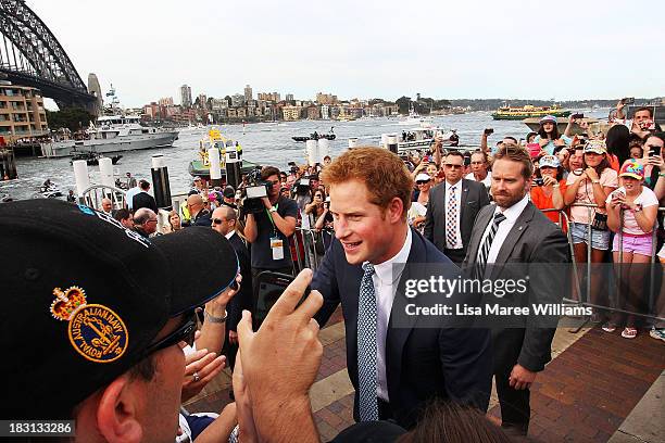 Prince Harry greets fans at Campbell Cove on October 5, 2013 in Sydney, Australia. Over 50 ships participate in the International Fleet Review at...