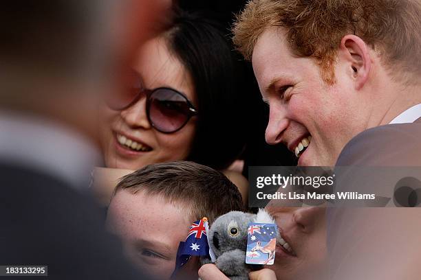 Prince Harry greets fans at Campbell Cove on October 5, 2013 in Sydney, Australia. Over 50 ships participate in the International Fleet Review at...