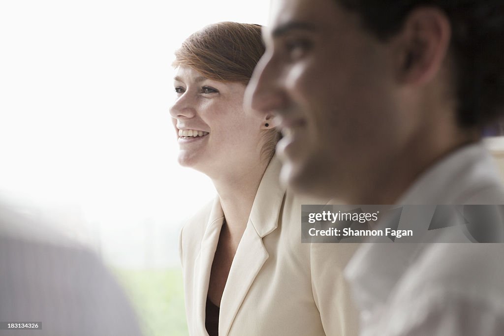 Smiling businesswoman talking to her colleagues