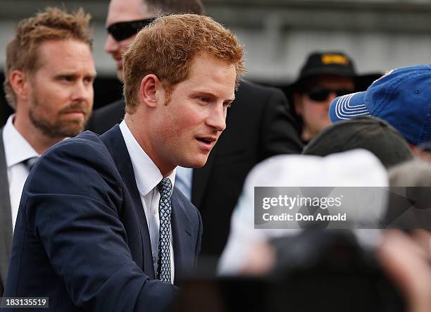 Prince Harry greets fans at Campbell Cove on October 5, 2013 in Sydney, Australia. Over 50 ships participate in the International Fleet Review at...