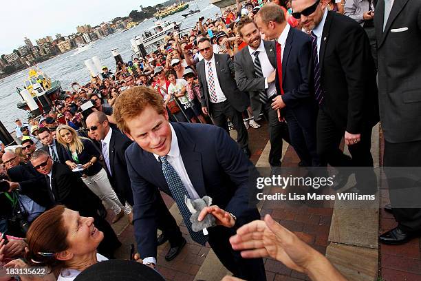 Prince Harry greets fans at Campbell Cove on October 5, 2013 in Sydney, Australia. Over 50 ships participate in the International Fleet Review at...