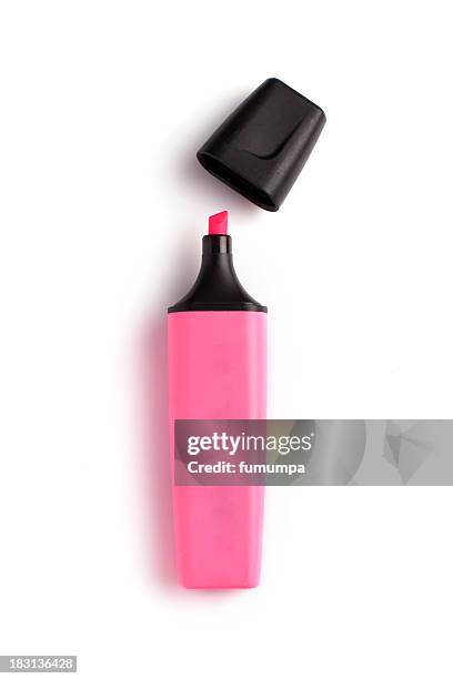 pink highlighter with the cap off on white background - highlighter stockfoto's en -beelden