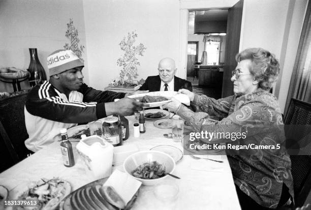 Boxer Mike Tyson, coach Cus D'Amato and D'Amato's wife Camille Ewald are photographed in 1985 in Catskill, New York.