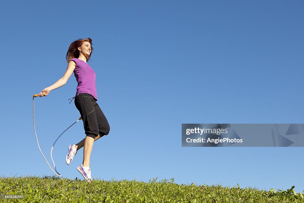 Young woman jumping rope