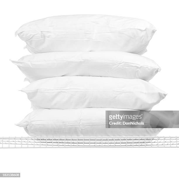 four pillows on shelf - white pillow stock pictures, royalty-free photos & images