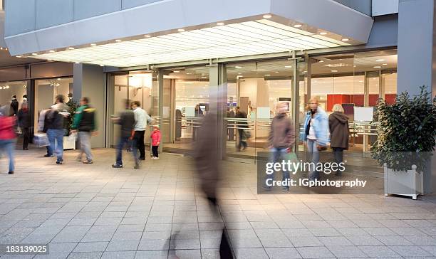 shopping mall entrance with people walking - boutique entrance stock pictures, royalty-free photos & images