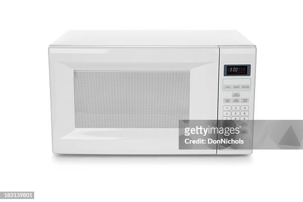 white microwave oven on white background - microwave stock pictures, royalty-free photos & images