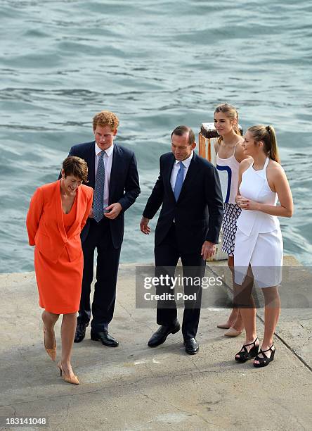 Prince Harry is greeted by Australian Prime Minister Tony Abbott his wife Margie and daughters Bridget and Francis at the steps to Kirribilli House...