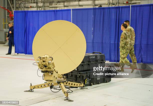 December 2023, Rhineland-Palatinate, Ramstein-Miesenbach: A satellite facility stands in the hangar before the start of the ceremony to activate the...