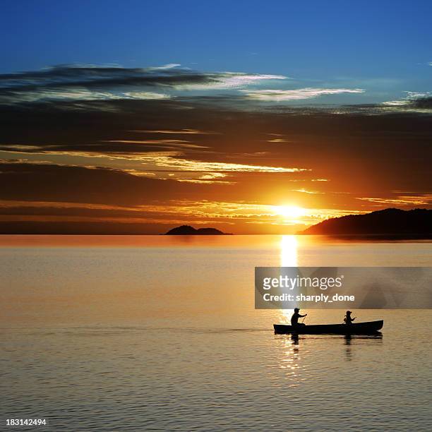 xl canoe sunset - michigan v wisconsin stock pictures, royalty-free photos & images
