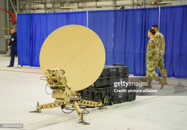 December 2023, Rhineland-Palatinate, Ramstein-Miesenbach: A satellite facility stands in the hangar before the start of the ceremony to activate the...