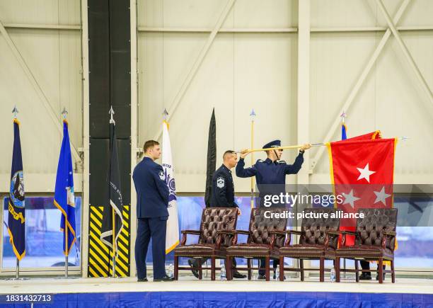 December 2023, Rhineland-Palatinate, Ramstein-Miesenbach: The flags of the various partners are prepared for the ceremony to activate the US Space...
