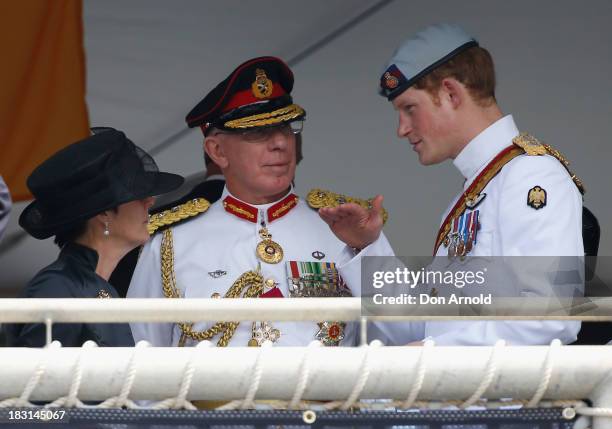 Prince Harry chats with dignitaries on board Leeuwin on October 5, 2013 in Sydney, Australia. Over 50 ships participate in the International Fleet...