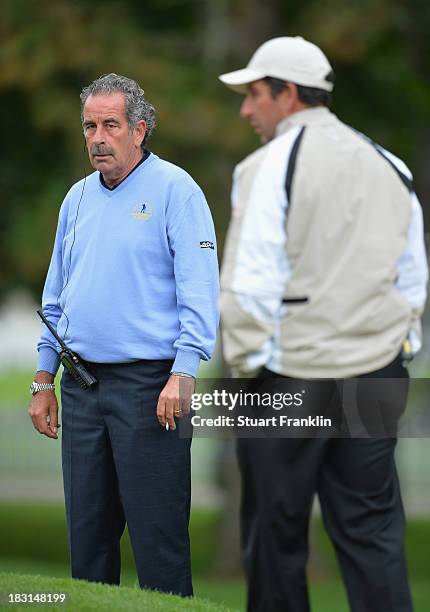 Sam Torrance, captain of the Great Britain and Ireland team looks at Jose Maria Olazabal, captain of the European team during the third day's morning...